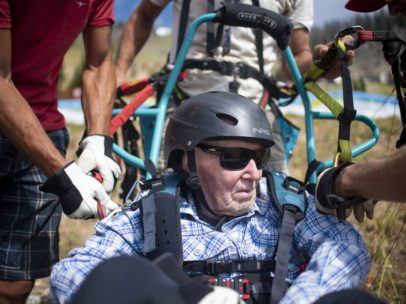 US veteran takes flight, sets adaptive paragliding record at 103